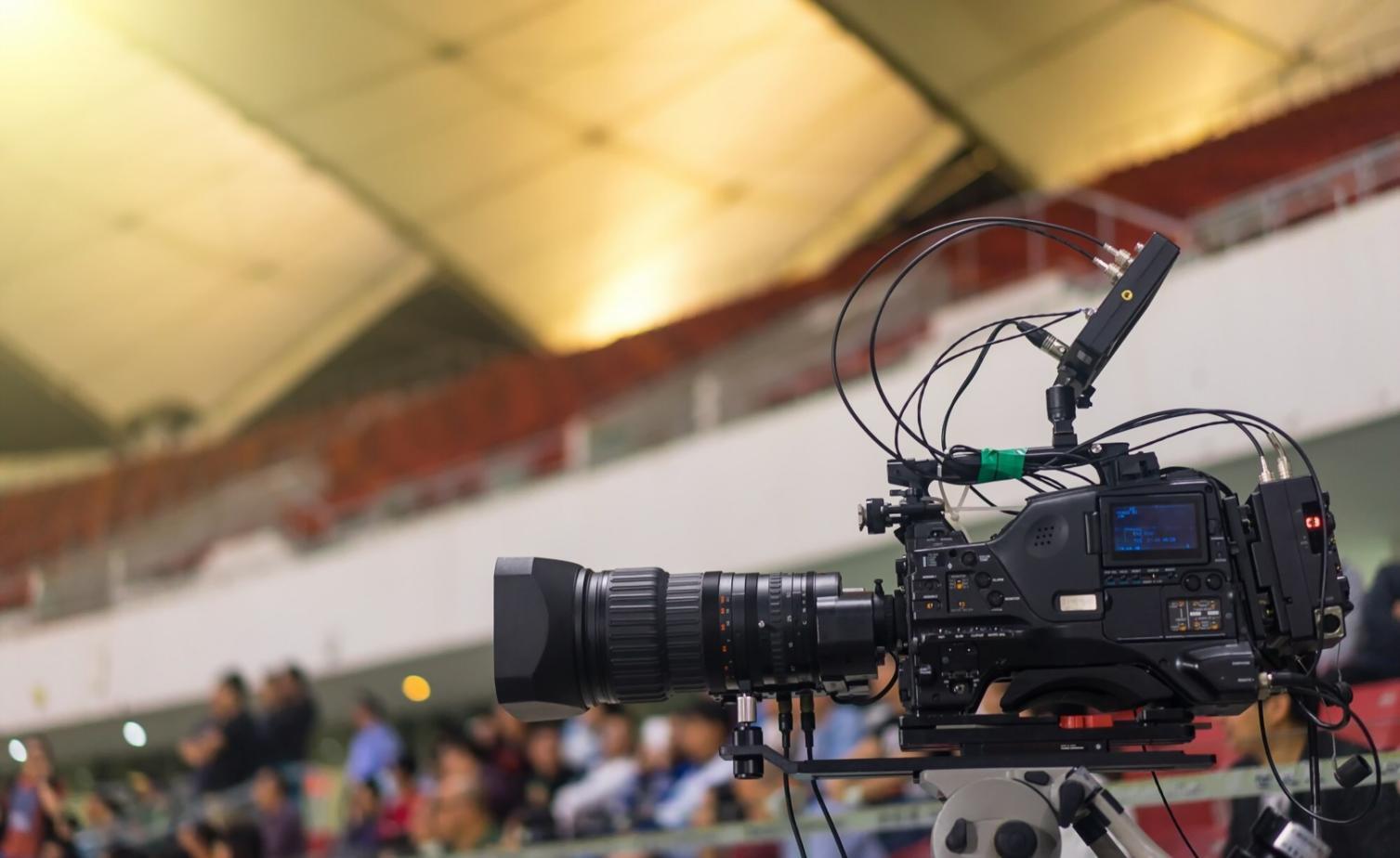 Student reviewing motion graphics project on dual monitors